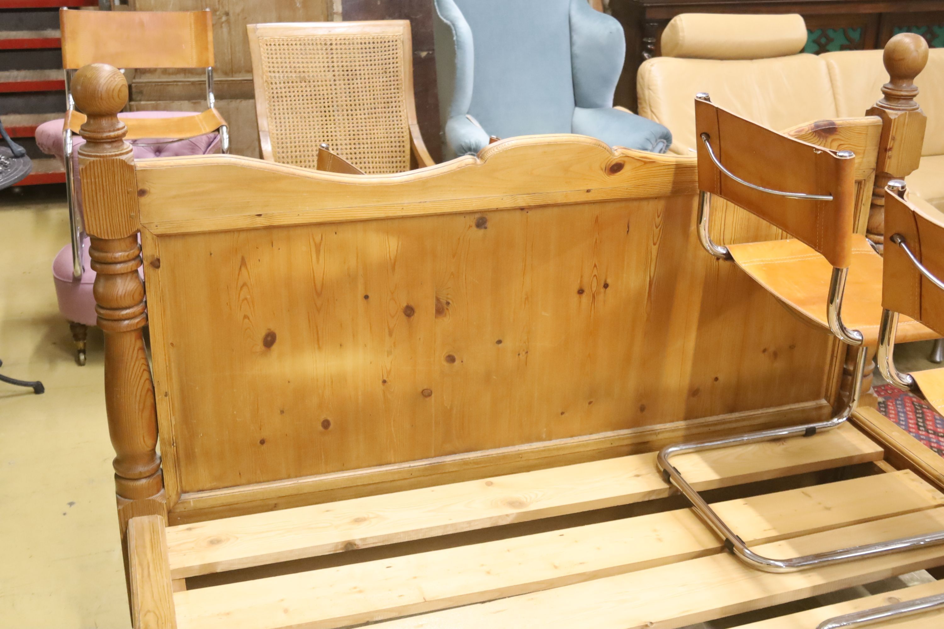 A king size pine bed frame with side rails and slats, width 170cm, length 213cm